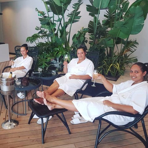 Sanctuary Spa Clients Relaxing Poolside